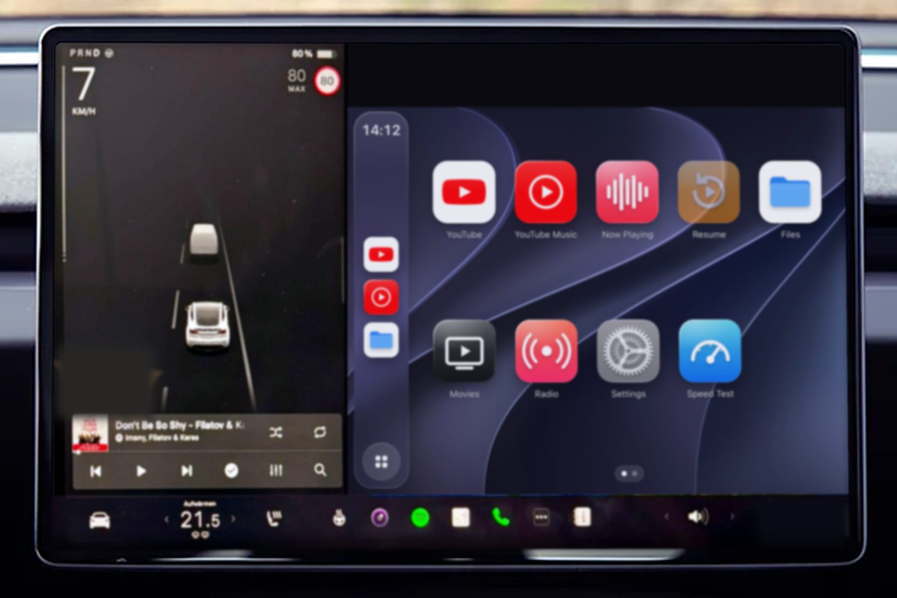 CarPlayer beside Tesla's driving view